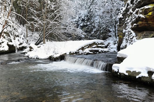 Winter river with snow in the Czech Switzerland
