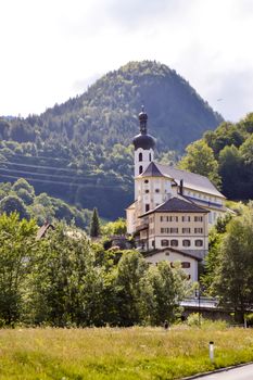 View of a church and chapel typical of the Austrian Tyrol with a small garden