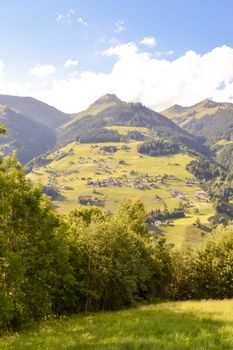 View of a valley and green hills in the Austrian Tyrol