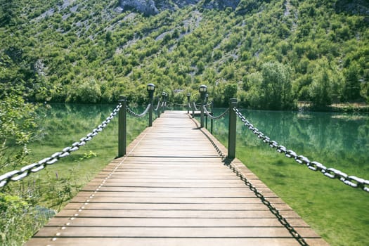 Wooden Bridge  in a river of Pirineos