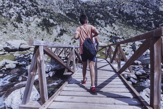 boy in a Mountains and lake photo with reflection