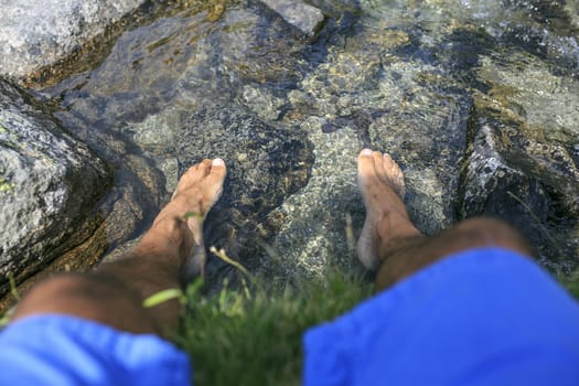 Man with his foots on the water