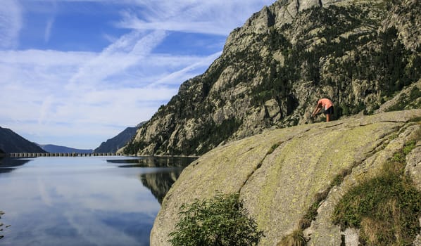 boy in a Mountains and lake photo with reflection