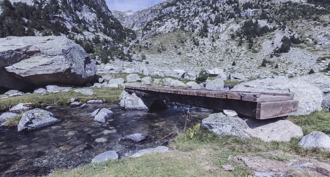 Wooden Bridge  in a river of Pirineos