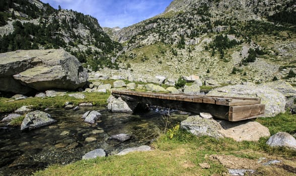 Wooden Bridge  in a river of Pirineos