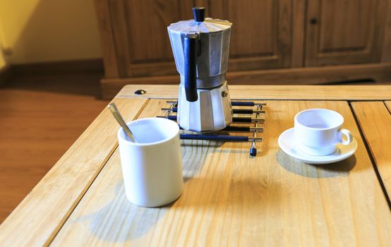 white Cofee cup in a wooden table