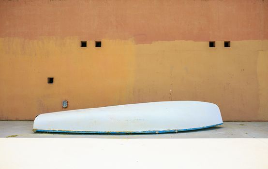 White boat in a orange wall