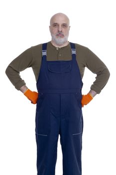 Serious man with a beard in building overalls