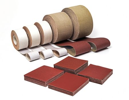Sandpaper in Rolls and Sheets for Industrial Use in Different Sizes and Thickness on White background