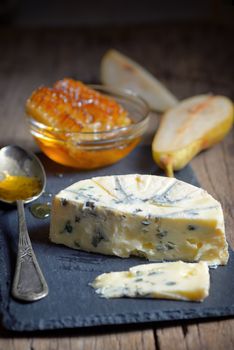 Blue Cheese and honey on ardesia plate