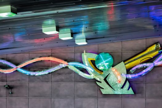 Man Shaped Neon Light in an Underground Car Park