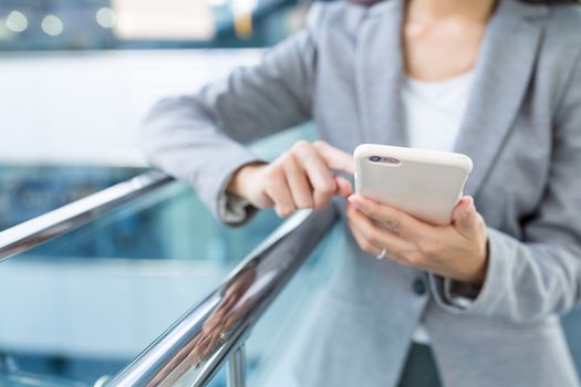 Businesswoman working on cellphone