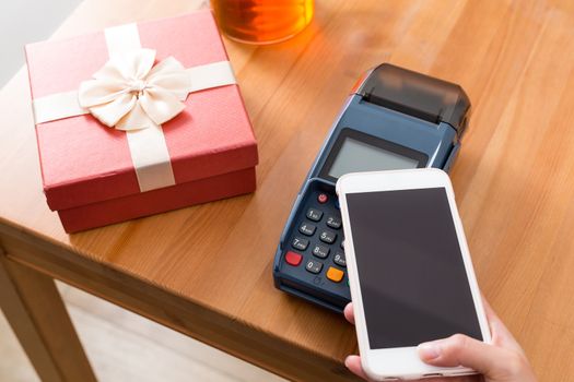 Pay money on POS machine for buying gift