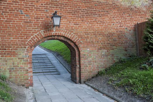 Old birck wall - entry to Cathedral in Frombork, Poland.