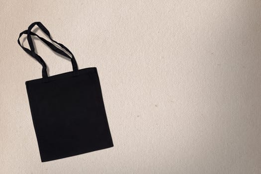black cotton bag for shopping on a light background