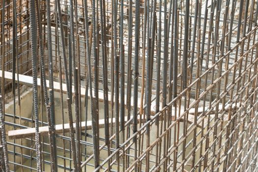 Rebar steel bars, reinforcement concrete bars with wire rod used in foundation of construction site.