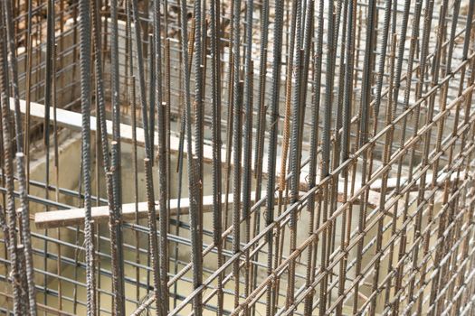 Rebar steel bars, reinforcement concrete bars with wire rod used in foundation of construction site.