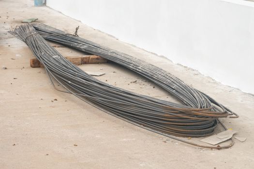 Rebar steel bars, reinforcement concrete bars with wire rod used in foundation of construction site.