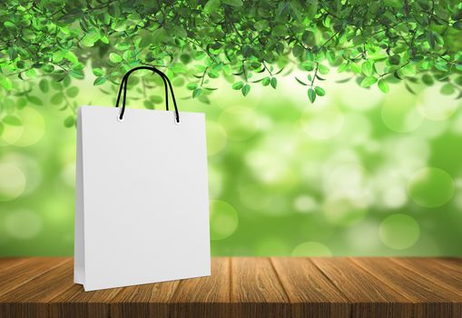 white paper bag for shopping on a wooden background