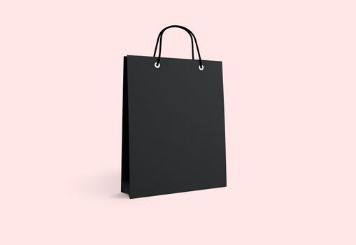 black paper bag for shopping on a pink background