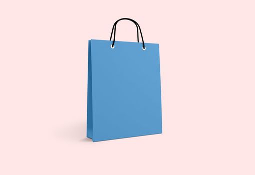 blue paper bag for shopping on a pink background
