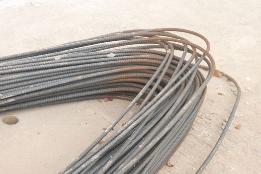 Rebar steel bars, reinforcement concrete bars with wire rod used in foundation of construction site.