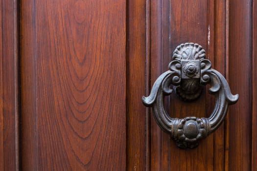 Close up of rustic old door in Florence, Italy.