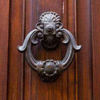 Close up of rustic old door in Florence, Italy.