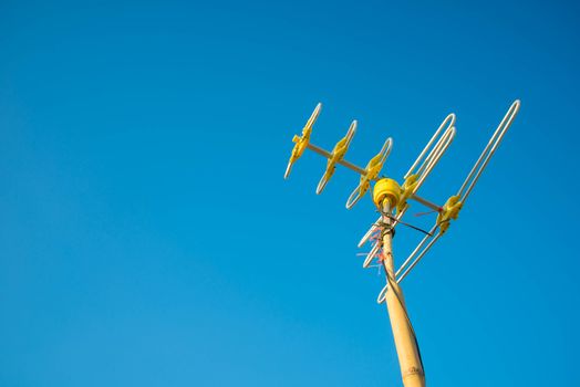 Antenna Television and blue sky background.