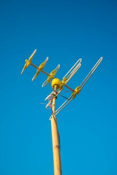 Antenna Television and blue sky background.