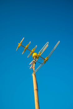 Antenna Television and blue sky background.