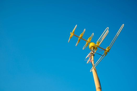 Antenna Television and blue sky background.