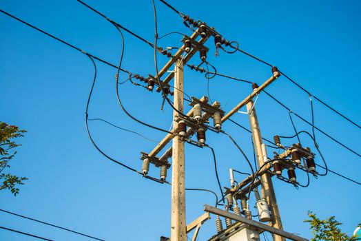 Electricity post and a blue sky background.