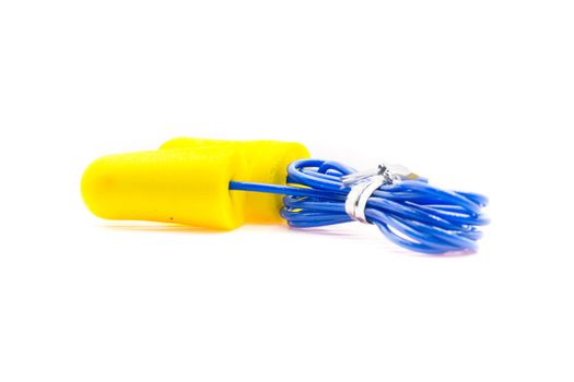 Yellow earplugs with blue band on white background.