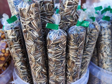 Sun flower seeds packed  in plastic bags for sale in a street kiosk