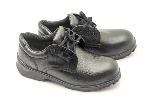 Protective workwear black safety shoes on white background.