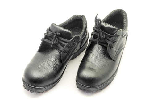 Protective workwear black safety shoes on white background.