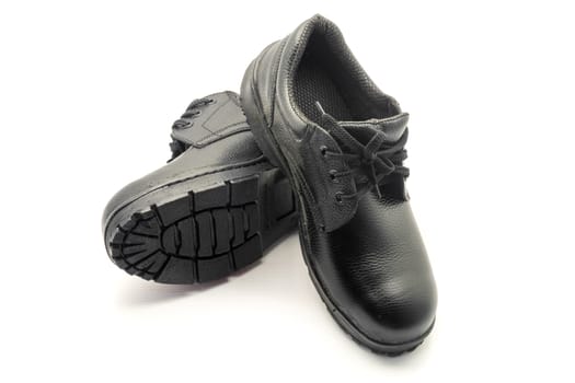 Protective workwear black safety shoes on white background.