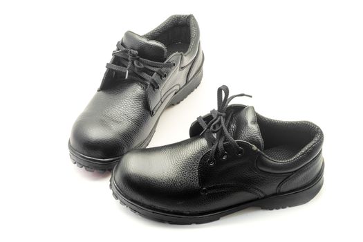 Protective workwear black safety shoes on white background.