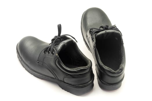 Protective workwear black safety shoes on white background.