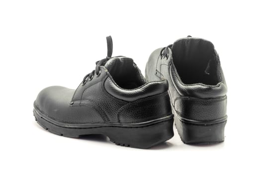 Protective workwear black safety shoes on white background.