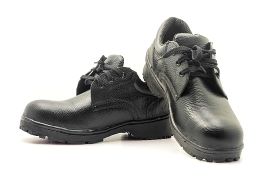 Protective workwear black safety shoes on white background.