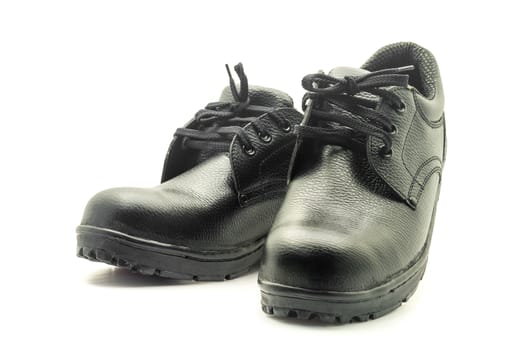 Protective workwear black safety shoes on white background.