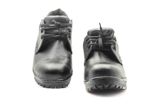 Protective workwear black safety shoes on white background.