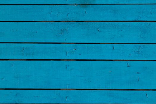 Blue vintage painted wooden panel with horizontal planks.