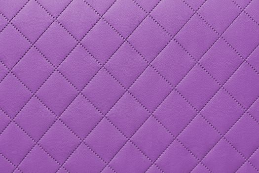 detail of sewn leather, purple leather upholstery background pattern