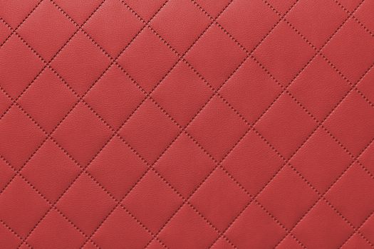 detail of sewn leather, red leather upholstery background pattern