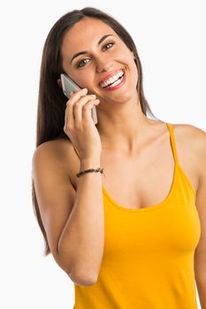 Beautiful and happy young woman talking at phone