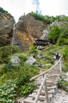 Rinka waterfall with eagles nest lookout in Logar - Logarska valley, Slovenia is a popular hiking destination in the Alps