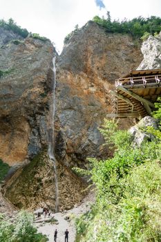 Rinka waterfall with eagles nest lookout in Logar - Logarska valley, Slovenia is a popular hiking destination in the Alps